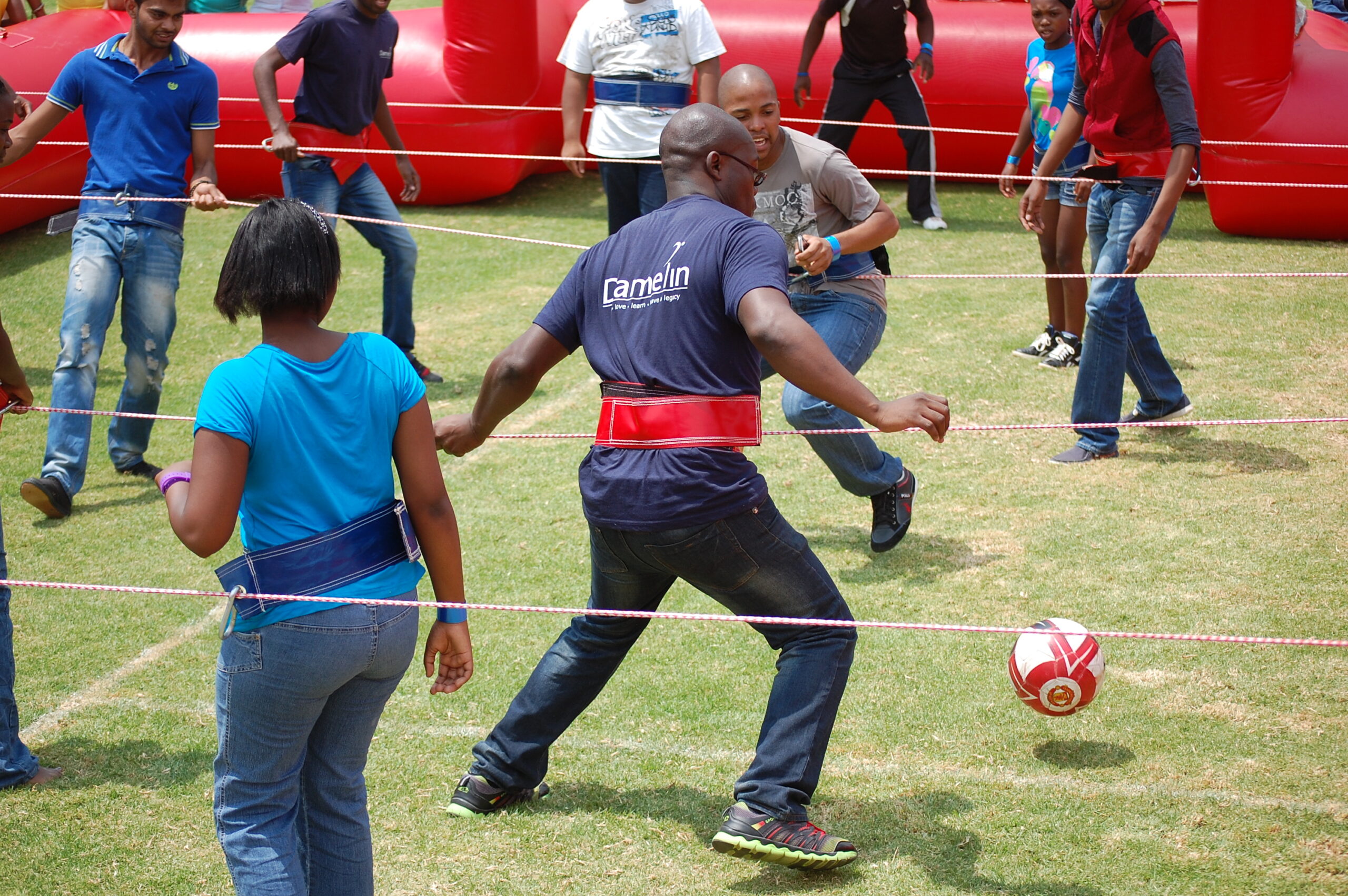 School learners enjoying a foosball team-building activity during a fun day